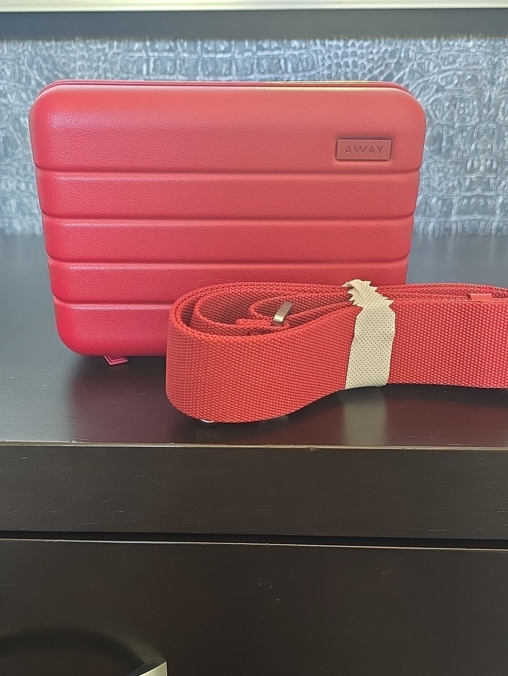 Away Small Hard-Shell Crossbody Case in  Tango Red with Matching Strap